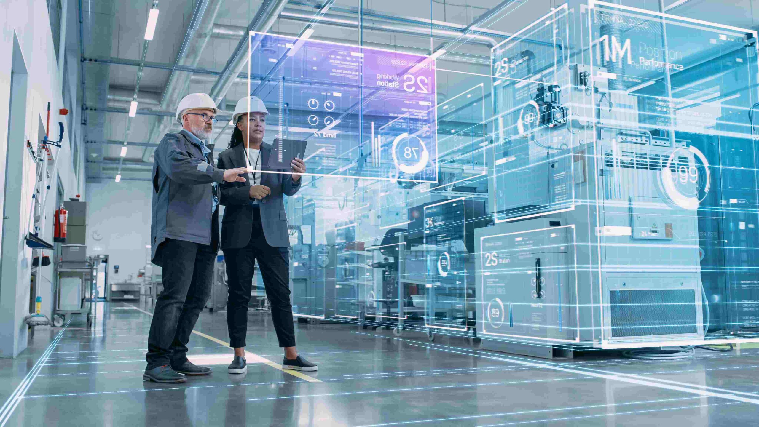 Smart Manufacturing and Human-Led Quality in 2025 Two engineers in a smart factory reviewing digital performance data, symbolising technology-driven quality management and human collaboration