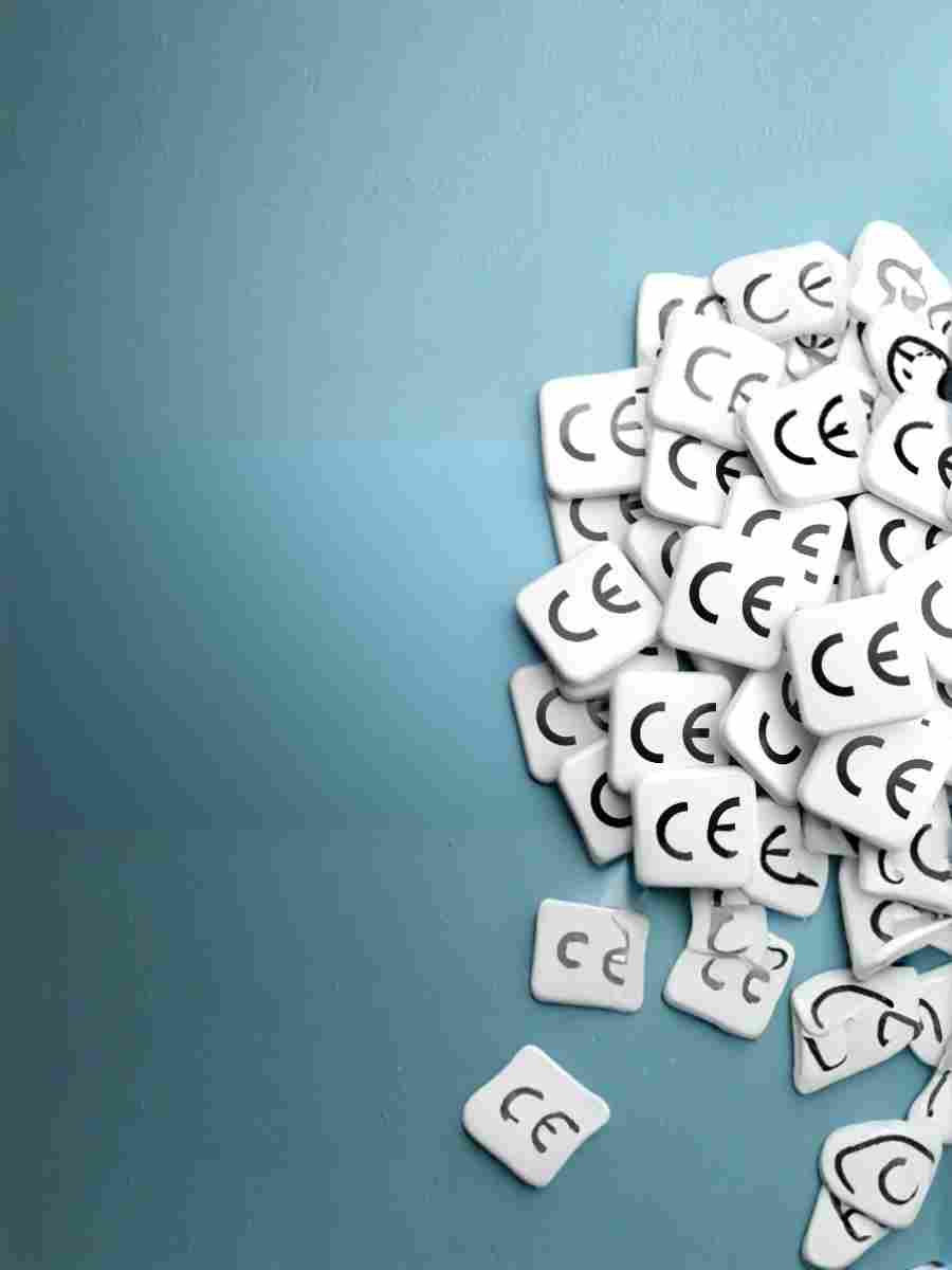 CE Marking and Compliance What the New EU Toy Safety Regulation Means Pile of CE marking symbols on white tiles against a blue background, representing product compliance under EU regulations.