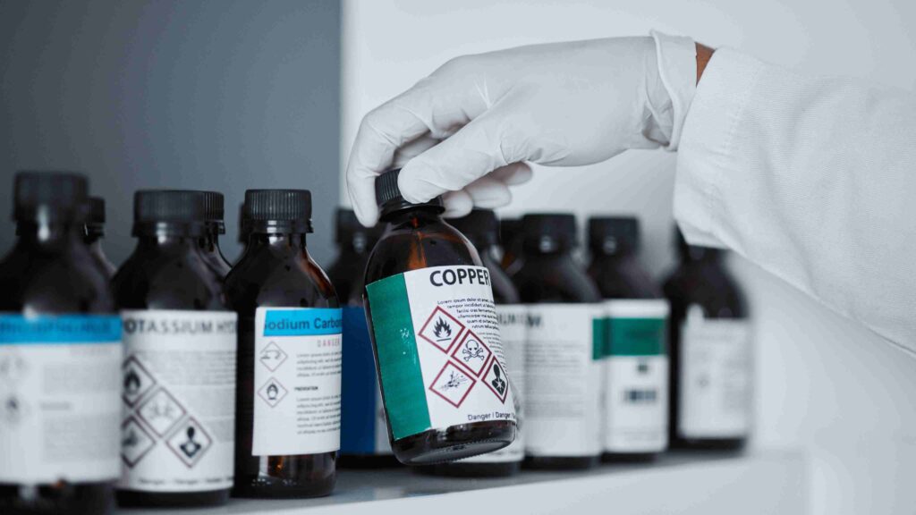 Irish chemical compliance concept — business professional reviewing ECHA and CLP regulatory updates on a digital tablet with chemical safety icons and EU flags in background