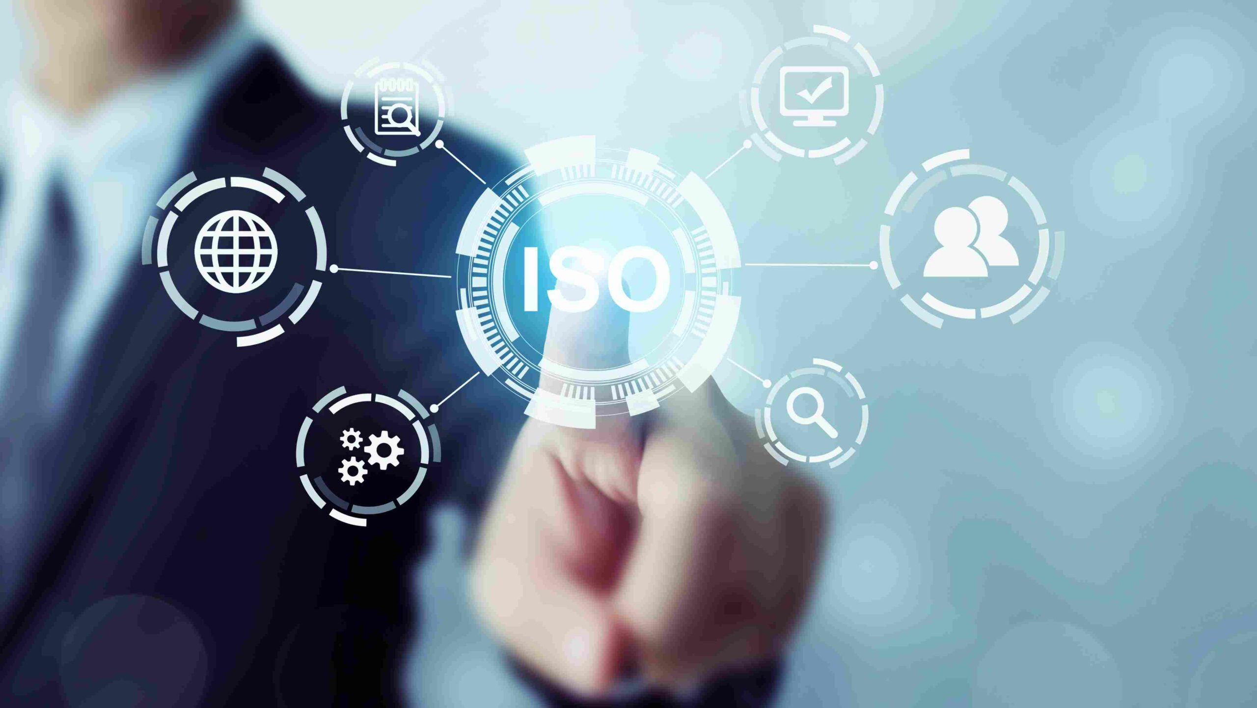 ISO Standards Digital Interface and Compliance Network Business professional touching a digital interface with the ISO logo at the center, surrounded by icons representing global standards, quality, processes, and collaboration.