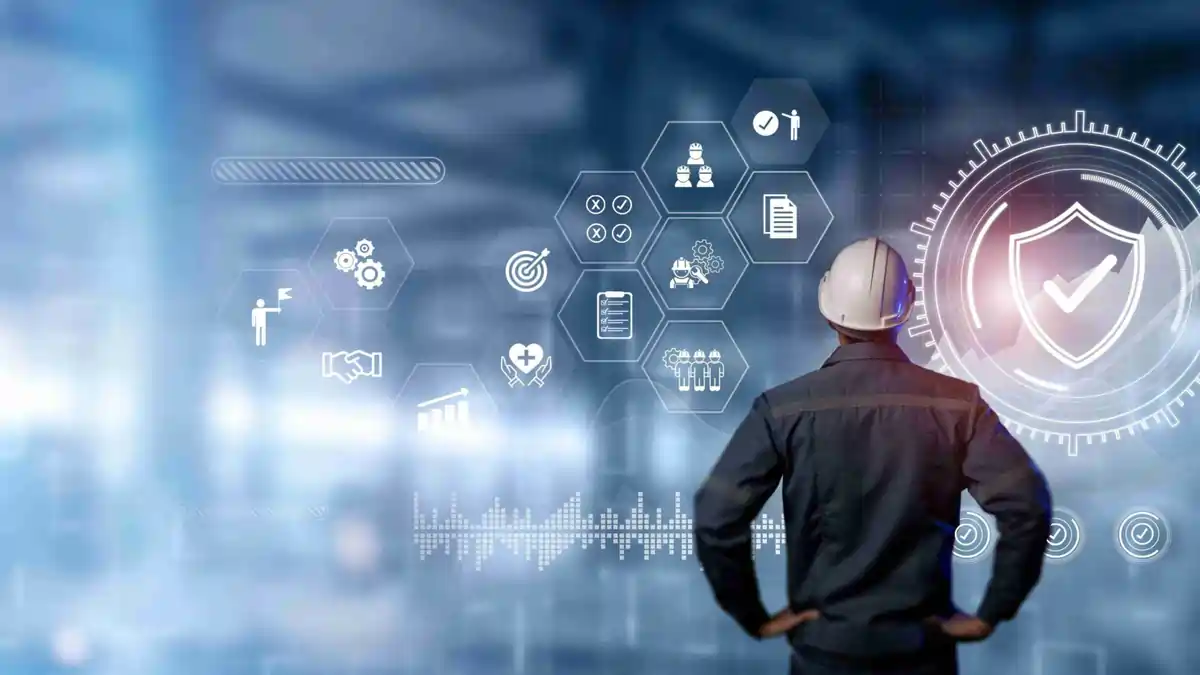 Digital Safety Transformation: AI and Data at the Core of HSA’s 2025 Vision Engineer wearing a safety helmet viewing a futuristic digital interface with safety and compliance icons, symbolising AI-driven safety management and workplace compliance in 2025.