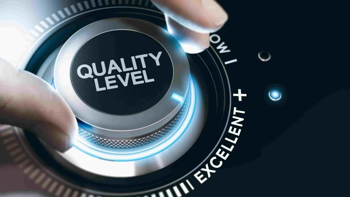 Enhancing Quality Levels Through Continuous Improvement Hand turning a dial labelled “Quality Level” toward the “Excellent” setting, symbolising quality improvement and performance enhancement.