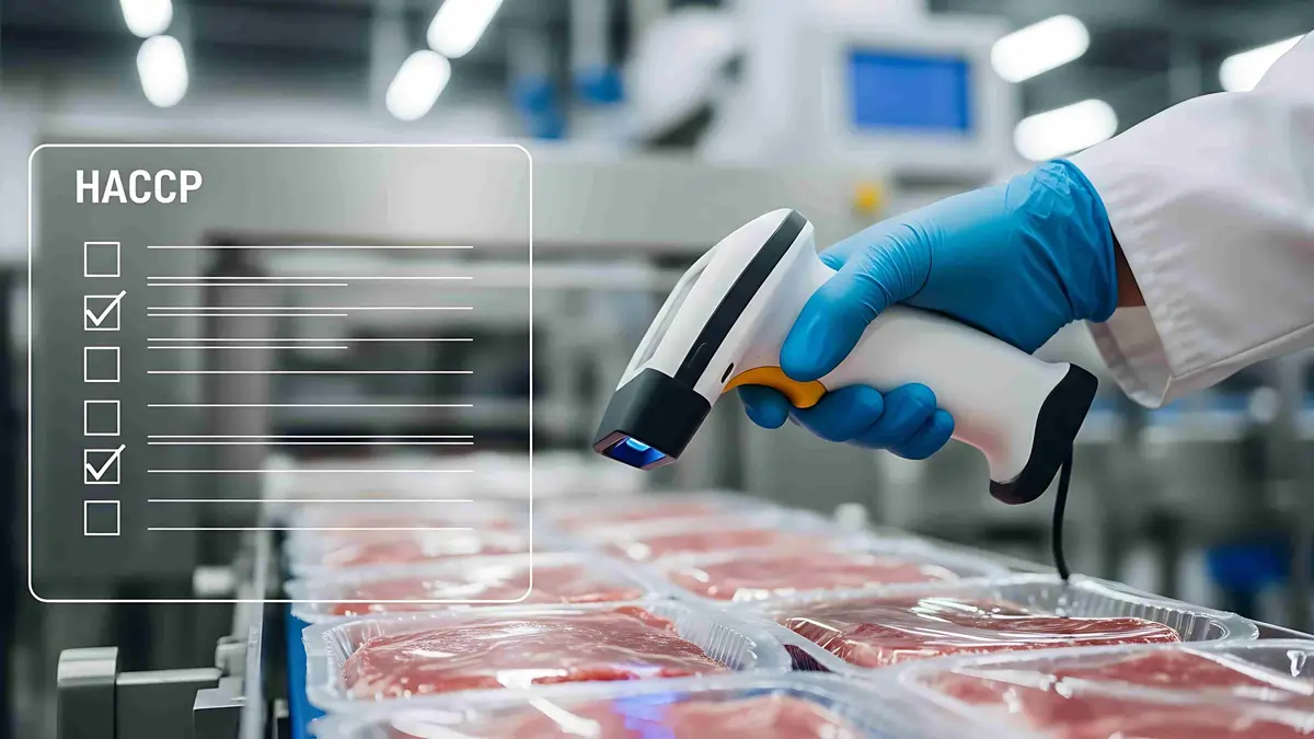 HACCP Compliance and Quality Control in Food Manufacturing Food safety inspection using handheld scanner to verify HACCP compliance in packaged meat production