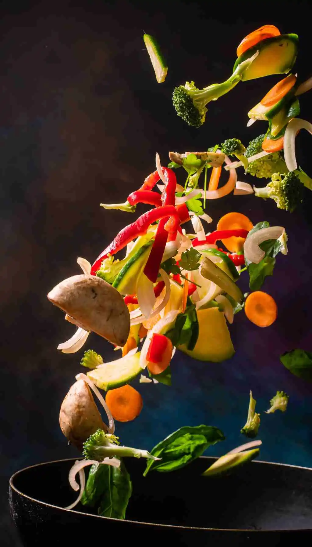 Creative Use of Fresh Ingredients to Reduce Food Waste Fresh vegetables being cooked together in a pan, showing efficient use of ingredients to reduce food waste
