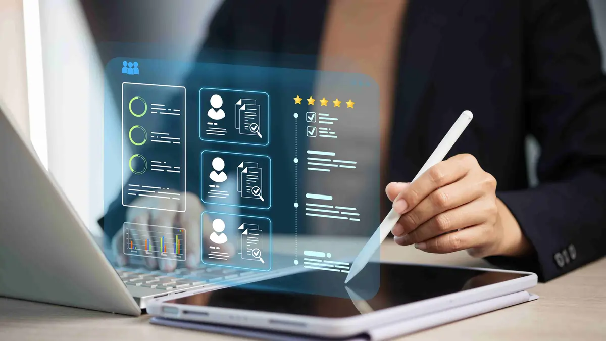 Worker seated in a waiting area holding her lower back in pain while a colleague offers water