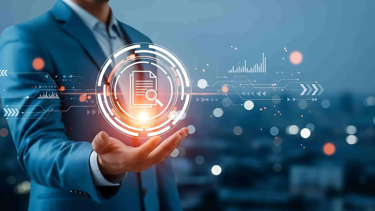 Food handler sanitising stainless steel surface in commercial kitchen following HACCP procedures in Ireland