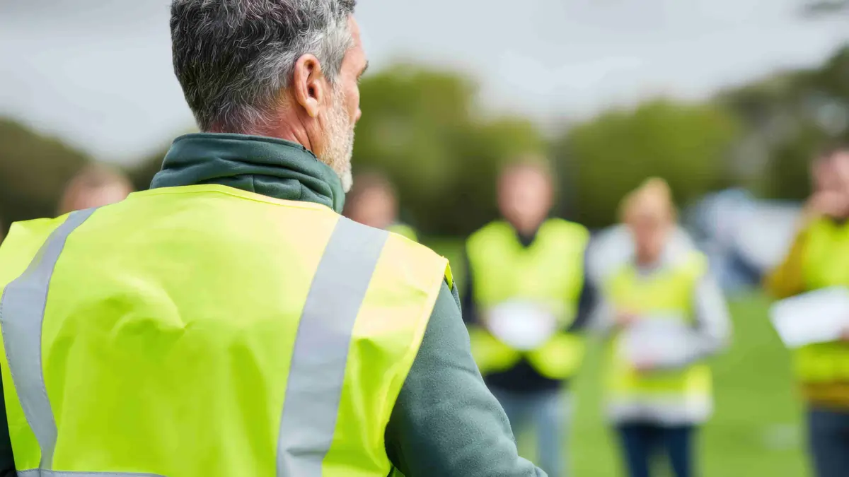 Horizontal blog images (60) Waiter serving a plated main course at a restaurant table during evening service
